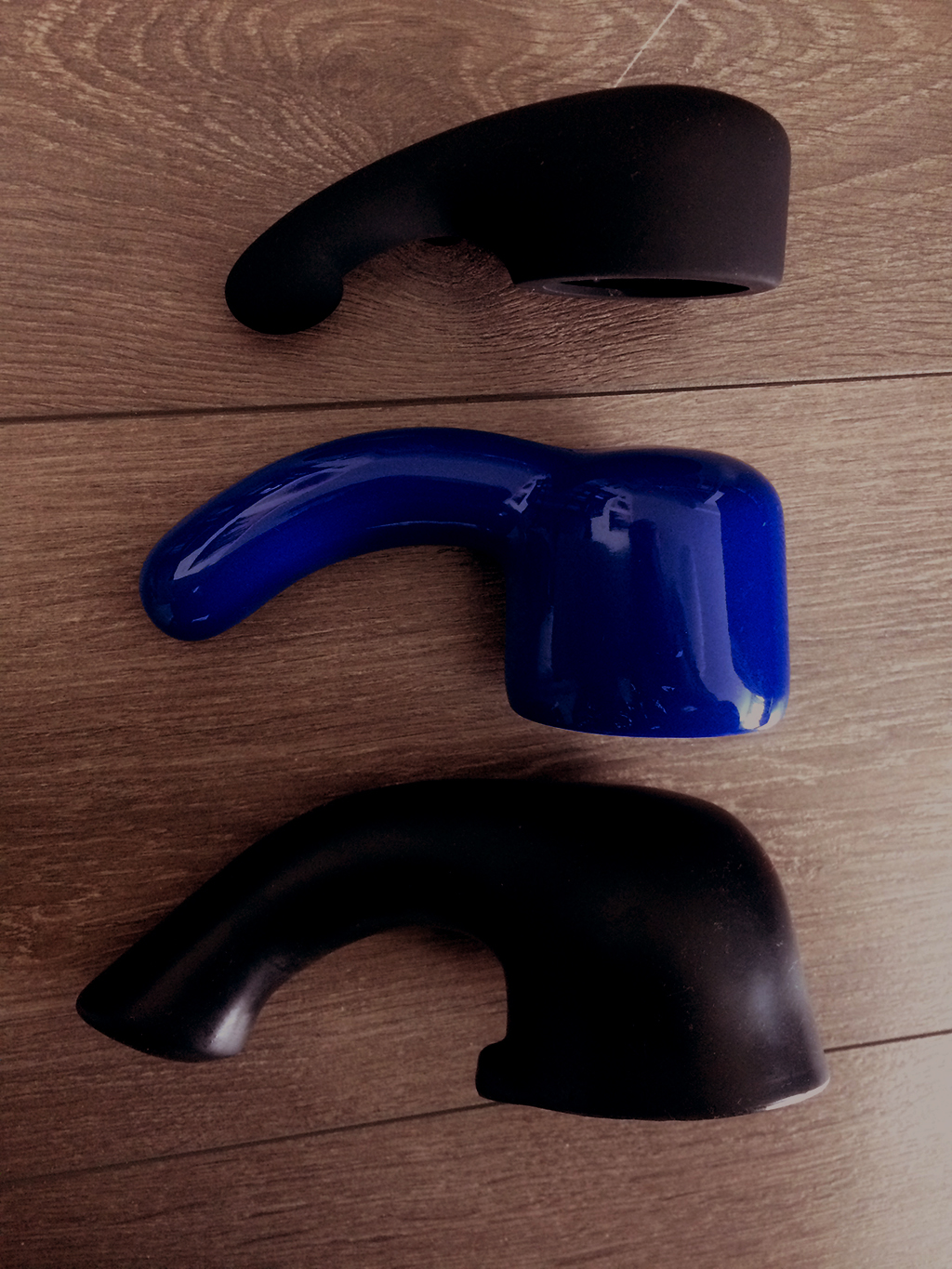 photo comparison of Tantus Rumble, Vibratex, and Pleasureworks wand caps