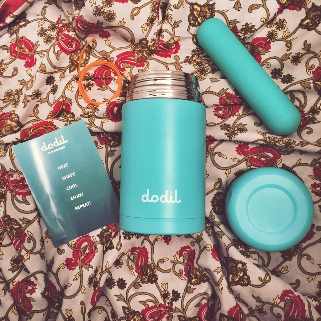 above photo of Dodil thermos contents - dildo, instruction book, string