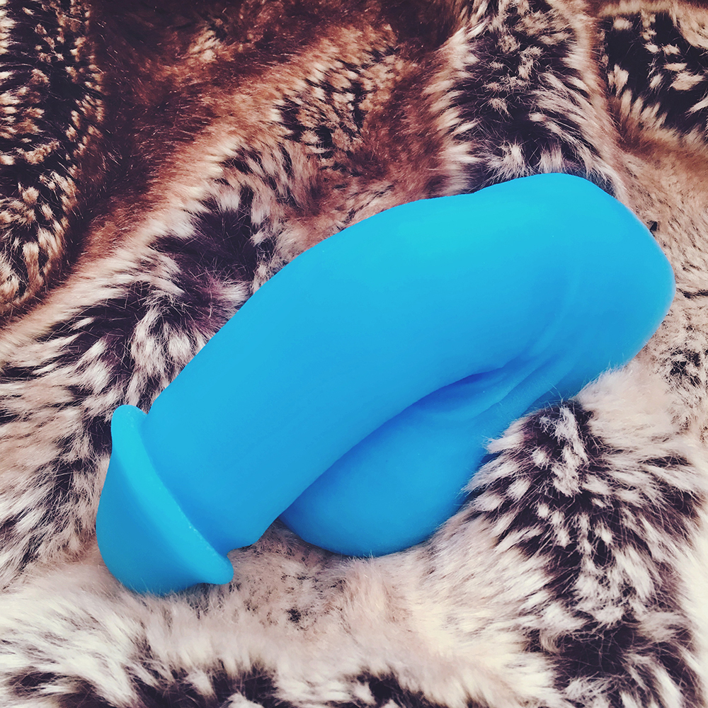 above photo of blue flacid circumcised packing dildo