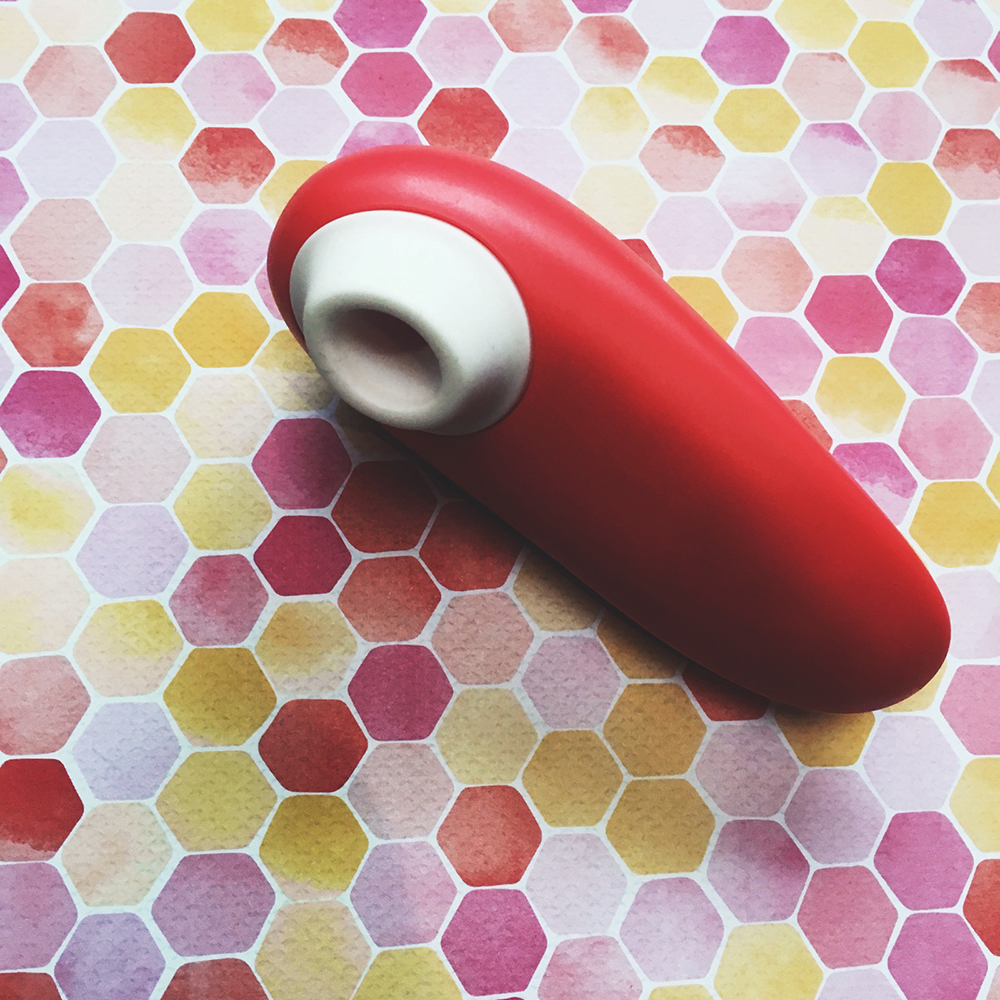 photo of peach oval shaped toy front with white cone shaped nozzle