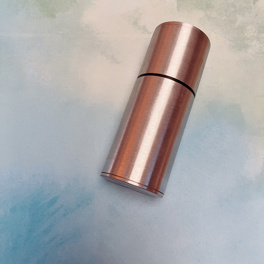 Profile view of metal cylinder canister