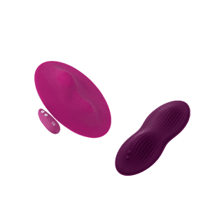two oval shaped pink pads with vibration bumps along the middle 