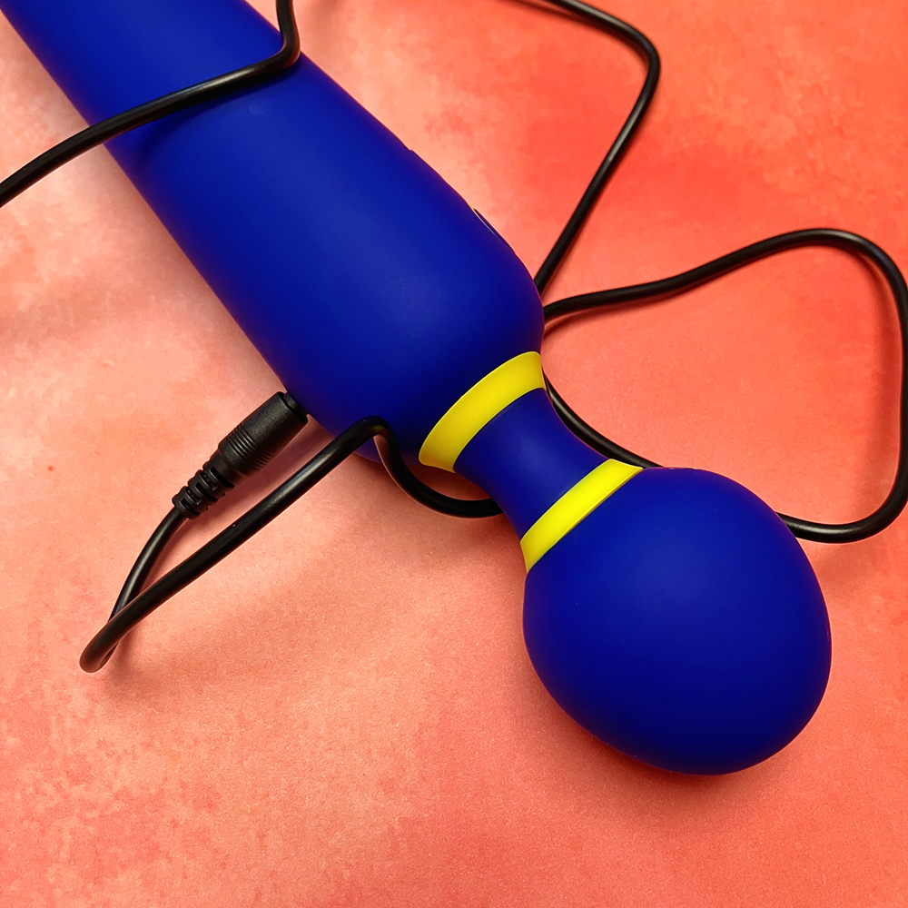 photograph showing the USB charging cable plugged into the back of the wand vibrator